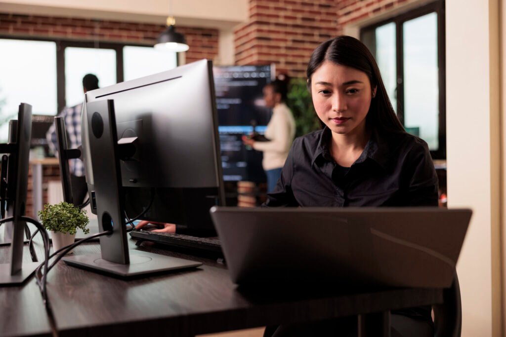 Developer working on server code in a modern office